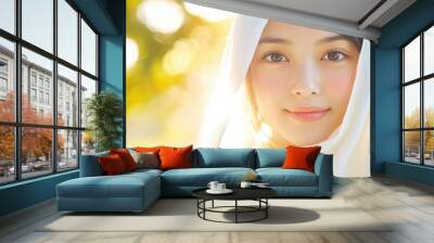 A young Japanese woman beams softly, draped in a delicate white cloth that enhances her graceful beauty. Wall mural