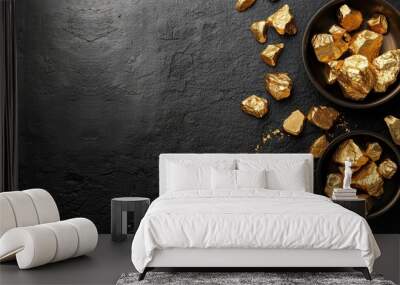 Gold nuggets and ingots arranged on a black table.

 Wall mural