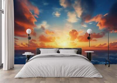 Sunset with sun and clouds on blue and orange dramatic sky with sun rays Wall mural