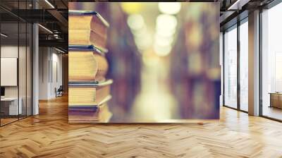 Book stack in library study room with old bookshelf for business and education background, class learning and back to school concept Wall mural