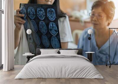 Brain disease diagnosis with medical doctor diagnosing elderly ageing patient neurodegenerative illness problem seeing Magnetic Resonance Imaging (MRI) film for neurological medical treatment Wall mural