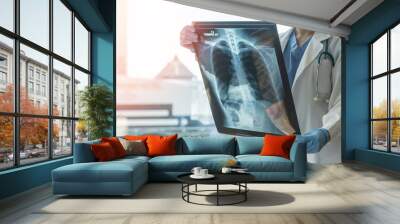 Doctor diagnosing patient’s health on asthma, lung disease, COVID-19 or bone cancer illness with radiological chest x-ray film for medical healthcare hospital service Wall mural