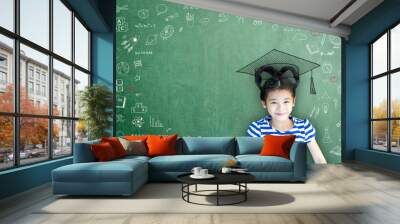 Smart educated school kid student with graduation hat doodle on chalkboard  for children's education success and scholarship concept Wall mural