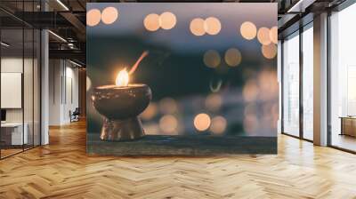 Soul and spirituality abstract concept  for mourning and world human spirit day with warm candle light bokeh illumination, golden sunset sky and reflective river wave background Wall mural