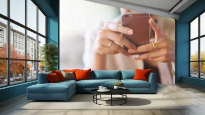 close up hand hold mobile phone device:focus on trendy girl call text on smartphone concept	 Wall mural