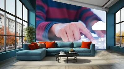 close up man hand touch screen on smart phone to transfer or synch data upload with laptop and download from cloud computing storage technology service with virtual interface for futuristic technology Wall mural