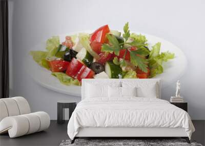 Greek Salad on white plate and gray background Wall mural