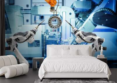 Industrial welding robot and gripping robot working with metal parts on smart factory, on machine blue tone color background, industry 4.0 and AI, automation robotic work instead on human concept Wall mural