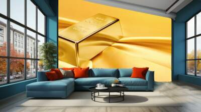 Gold bar on satin fabric. financial concept. Wall mural