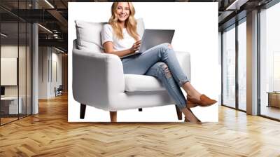 A fictional person, blond woman sitting on a white arm chair with laptop, generative AI  Wall mural