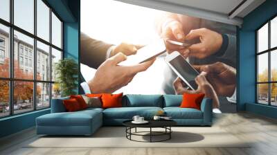 Business people, hands and phone with circle for calendar, schedule and social media feedback check. Web designer, team and mobile networking with collaboration, research and app design in office Wall mural