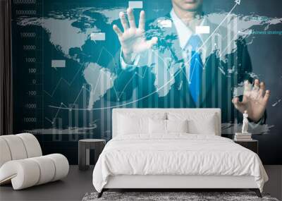 Businessman works with virtual holographic interface for data analysis. Future technology concept Wall mural