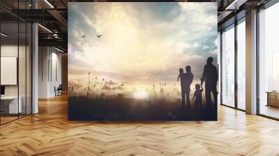 international migrants day concept: father, mother and two son over meadow autumn sunset background Wall mural