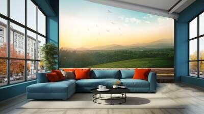 World environment day concept: Wooden table and mountain sunrise background Wall mural