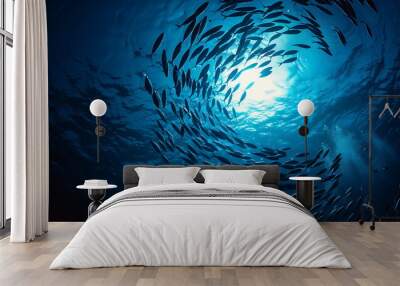 schooling fish swim around in the ocean Wall mural