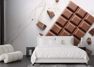 A single piece of dark chocolate on a white marble background Wall mural