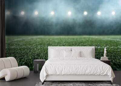 Football Field Under the Spotlight: A dramatic low angle view of a green football field bathed in the glow of stadium lights, with a hazy atmosphere adding to the sense of anticipation and excitement. Wall mural