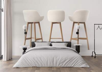 Three modern white bar stools with wooden legs arranged in a row against a plain background, showcasing minimalist interior design furniture. Wall mural