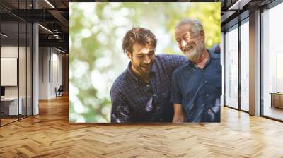 Adult hipster son fun hugging old senior father at home, two generations have a beard talking together and relaxing with smile, 2 man happy enjoy to living at home in father's day with love of family Wall mural