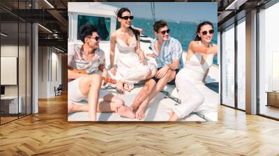 Caucasian couple who man and woman relax fun with luxury party drinking champagne by talking together while catamaran yacht boat sailing. Happy and enjoy outdoor lifestyle on summer vacation travel Wall mural