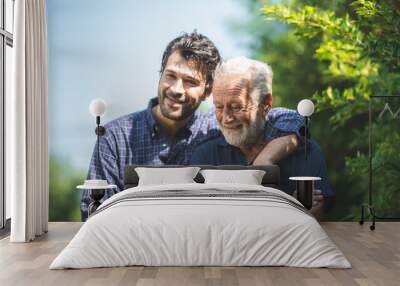 caucasian senior father and adult son are hugging together at home, generation family are happy with people love, male mature, old person man, elderly grandfather smiling living at the house Wall mural