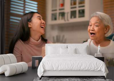 Family Togetherness in the Kitchen: Asian Mother Prepares a Happy Dinner, Joined by Father, Daughter, and Senior Elderly, Creating Fun and Memorable Meals, A Heartwarming Holiday Gathering Wall mural