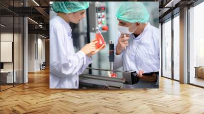 food technician control checking production line of water drink in manufacturing factory Wall mural