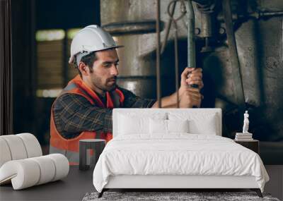 foreman with hard hat working vest on a construction site, middle aged or older technician engineer man in industrial factory, Professional heavy industry worker wearing uniform, men at work concept Wall mural