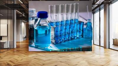 Glassware and blue liquid equipment in chemical laboratories Wall mural