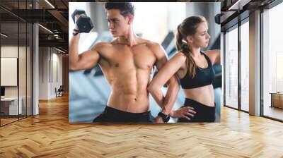 Gym fitness trainer concept, health lovers exercise in sports gym for a strong healthy body Wall mural