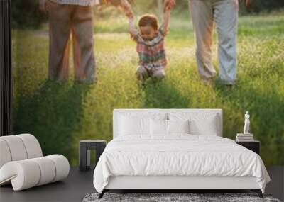 happy harmonious family outdoors concept father and mother and son have activities together on holidays, nature grassland field Wall mural