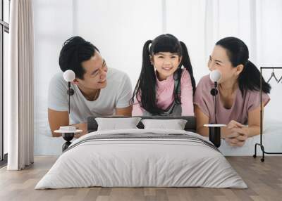 happy love family lifestyle with Asian father and mother and child daughter at home together Wall mural