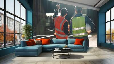 industrial factory with men at work concept, professional engineer foreman inspector talking in business occupation job teamwork with team, construction manager working in manufacturing technology job Wall mural