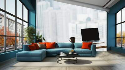 Light apartment interior with minimalist workplace and transparent chair and table with laptop and books on a white marble concrete floor near window with a city view Wall mural