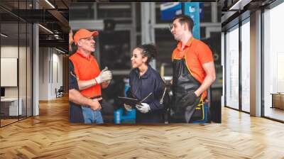 machanic team smiling to each other as they are a great teamwork, good teamwork good life, professional machanic engineer, work concept.wearing uniform Wall mural