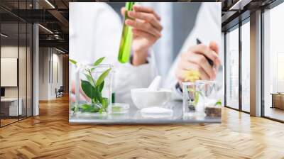 medicine chemical research with organic nature herbal plant in science laboratory, cosmetic extract liquid chemistry oil in glassware, leaf biology of beauty medicals care serum product experiment Wall mural