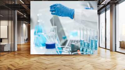 medicine research in chemical laboratory, chemist scientist working with liquid experiment test analysis by using scientific tube beaker glassware, chemistry science pharmaceutical medical lab concept Wall mural