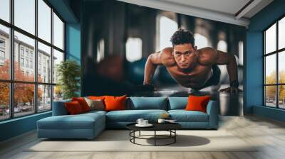 Muscular and strong athletic man doing Push up exercising in sport gym. Wall mural