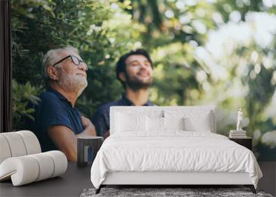 Old father and son, Morning coffee in a garden Wall mural