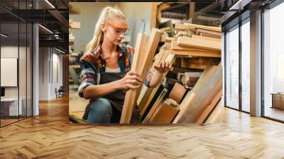 professional artisan carpenters woodworking team work together creatively, creative carpenter woman working workshop for wooden craft with wood tool at industry carpenter's shop, business of wood Wall mural