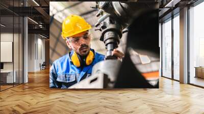 professional business industry technician wearing safety helmet working to maintenance service and checking factory equipment, a work of engineer occupation in manufacturing construction technology Wall mural