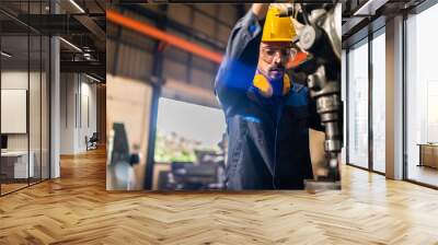 professional business industry technician wearing safety helmet working to maintenance service and checking factory equipment, a work of engineer occupation in manufacturing construction technology Wall mural