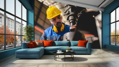 professional business industry technician wearing safety helmet working to maintenance service and checking factory equipment, a work of engineer occupation in manufacturing construction technology Wall mural