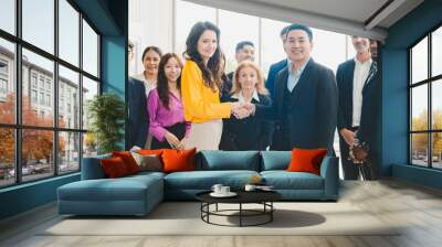 professional businessman person team meeting business partner for a deal agreements partnership job, using hand to make handshake with success teamwork, collaboration corporate work in office company Wall mural