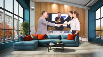 professional businessman person team meeting business partner for a deal agreements partnership job, using hand to make handshake with success teamwork, collaboration corporate work in office company Wall mural