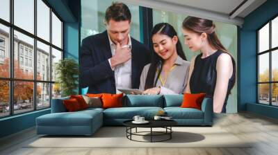 Professional diverse business people having collaboration team meeting in an office, technology and workers, men or employees with touchscreen planning sales, research or financial strategy in company Wall mural