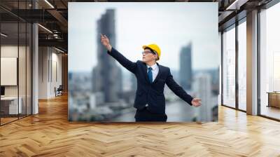 professional engineer and construction foreman team person with safety hard hat helmet discussion to working in business industry of architect job teamwork, a work at building construction site Wall mural