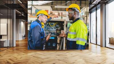 professional technician engineer with safety helmet hard hat working in industrial manufacturing factory, men at work to checking equipment of machinery production technology or construction operating Wall mural