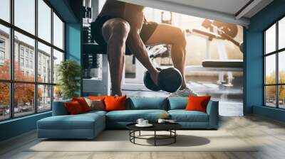 strong athlete man person exercising in the sport gym, workout exercise training in fitness for body strong and fit, bodybuilding and healthy lifestyle people Wall mural