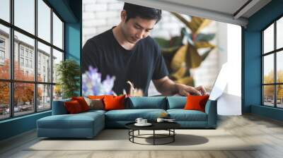 young business person man work from home with computer laptop with cyberspace Wall mural